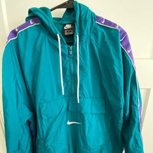 Nike 1/4 zip raincoat w/ hood. NEW WITHOUT TAGS
